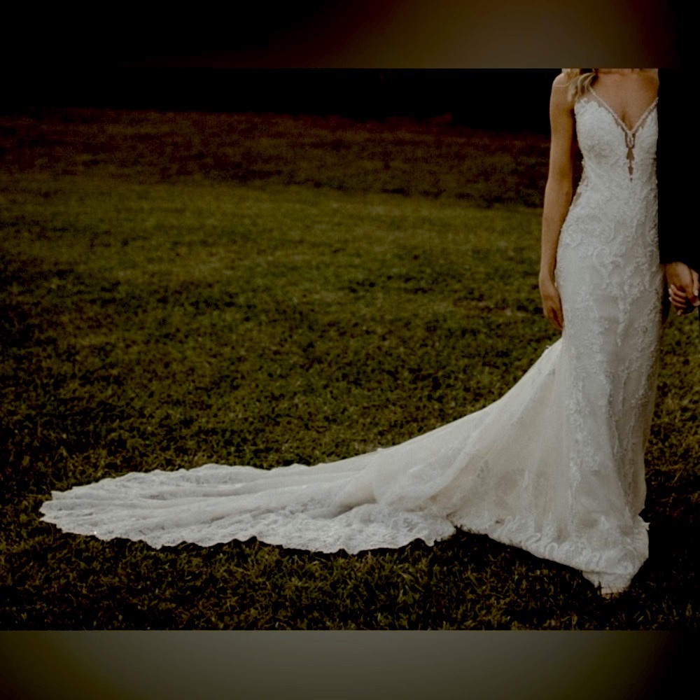 Size 0/2 off white fitted wedding dress with deep plunging neckline